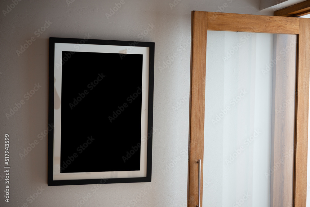 empty frame on the wall in the livingroom empty frame on the wall in the livingroom