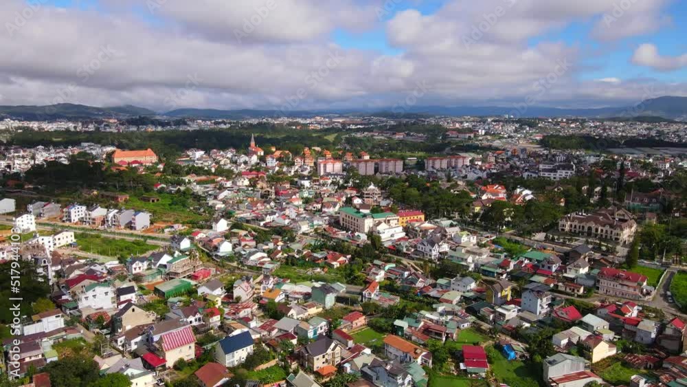 DA LAT CITY, VIETNAM - JULY 15,2022 : Landscape in the city of Da Lat city, Vietnam is a popular tourist destination. Tourist city in developed Vietnam. ( view aerial from drone ) DA LAT CITY, VIETNAM - JULY 15,2022 : Landscape in the city of Da Lat city, Vietnam is a popular tourist destination. Tourist city in developed Vietnam. ( view aerial from drone )