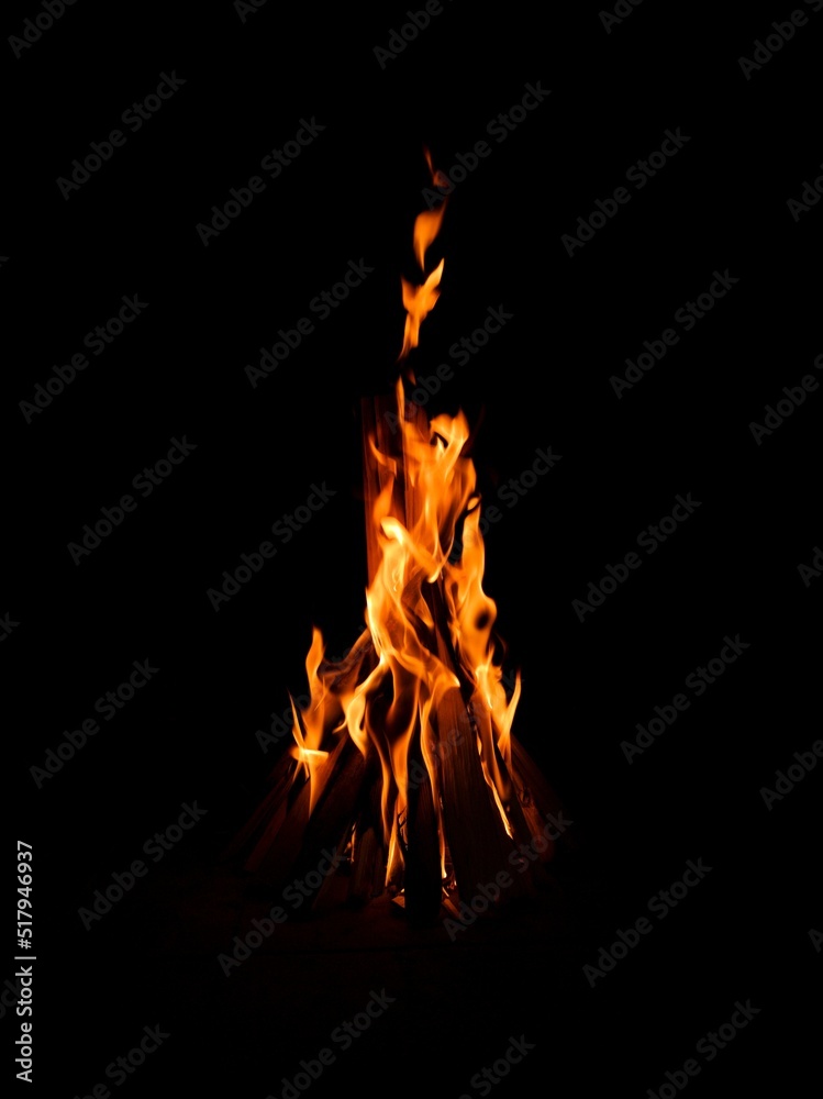 playing tongues and reflections of flame on a black background playing tongues and reflections of flame on a black background