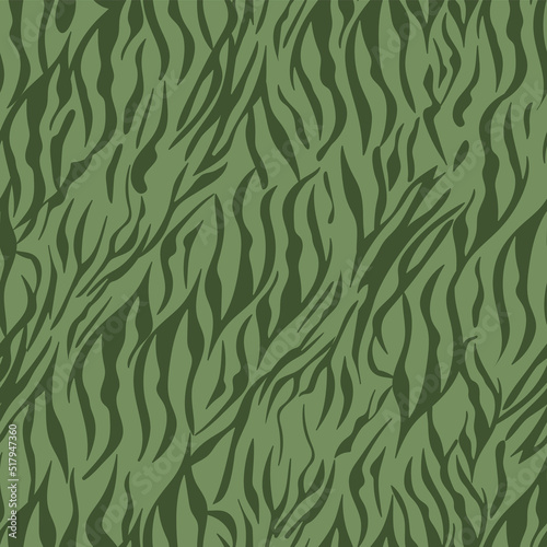 Seamless animalistic camouflage pattern. Animal skin background of zebra, tiger in trendy style. Abstract khaki line texture. Modern design for textiles and fabrics, wrapping paper.