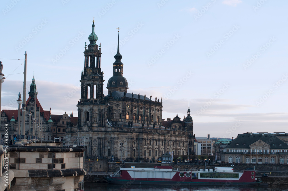 Frauenkirche on Brühl Terrace in Dresden on the Elba River and a pleasure boat. Historical and tourist attractions in Germany