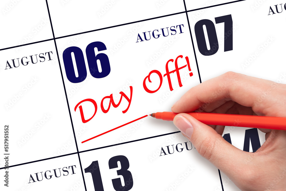 6th day of August. Hand writing text DAY OFF and drawing a line on calendar date 6 August. Vacation planning concept. Summer month, day of the year concept. 6th day of August. Hand writing text DAY OFF and drawing a line on calendar date 6 August. Vacation planning concept. Summer month, day of the year concept.