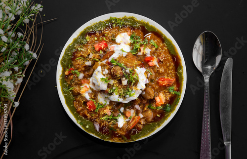 Chole tikki chaat also called aloo tikki chole is a popular Indian street food photo