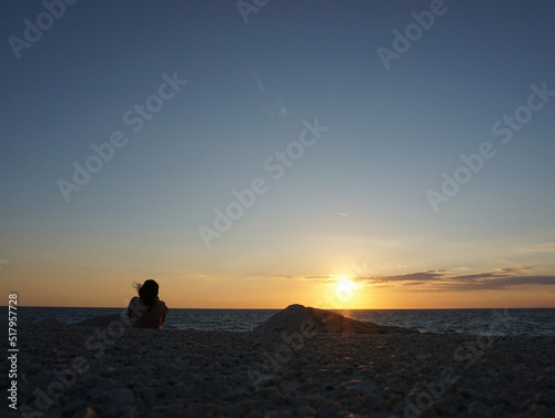 silhouette of a person at sunset