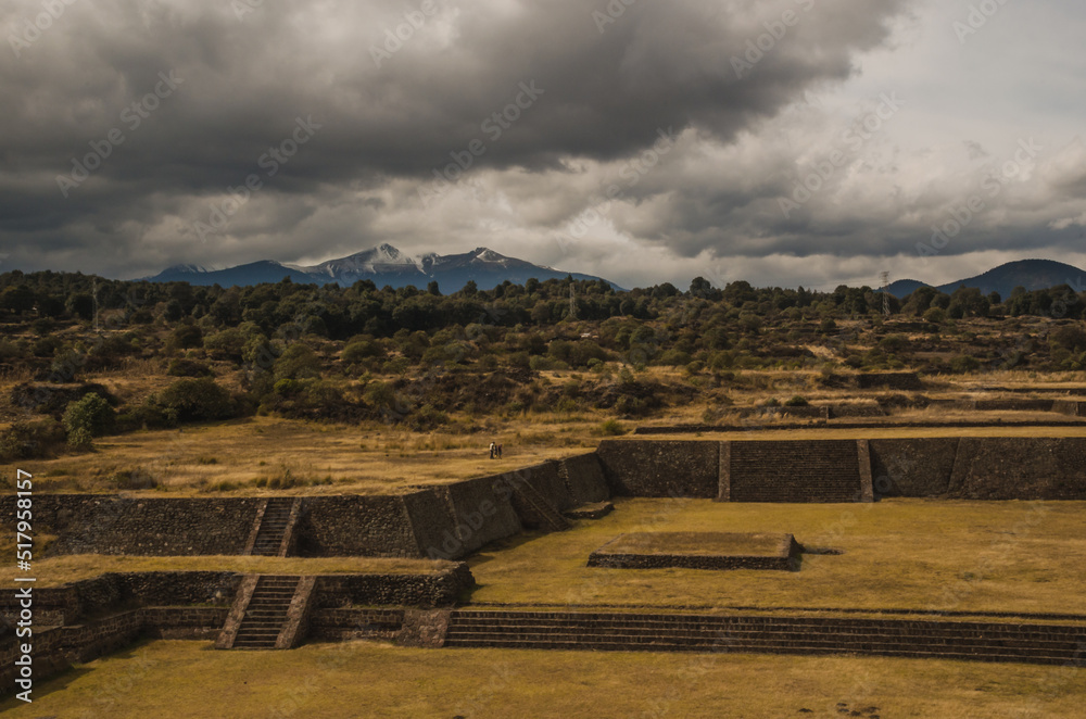 Pyramids and foundations of Teotenango, Matlatzinca archaeological zone in Tenango del Valle, State of Mexico, Mexico. In the background you can see the Nevado de Toluca Pyramids and foundations of Teotenango, Matlatzinca archaeological zone in Tenango del Valle, State of Mexico, Mexico. In the background you can see the Nevado de Toluca