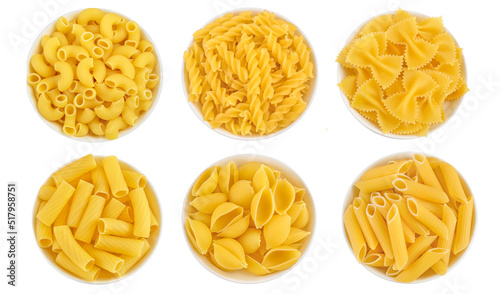 Raw italian pasta in ceramic bowl isolated on white background. Top view. Flat lay. Set or collection photo