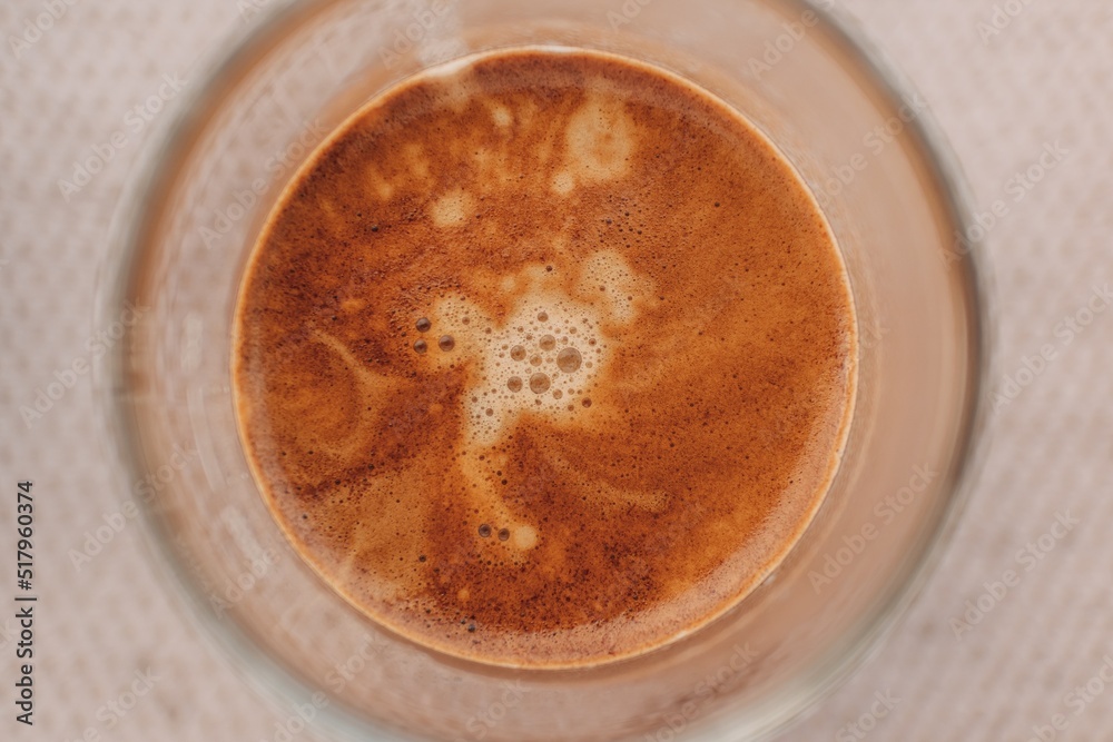 Close up top view of espresso coffee with beautiful crema in small glass. Close up top view of espresso coffee with beautiful crema in small glass.