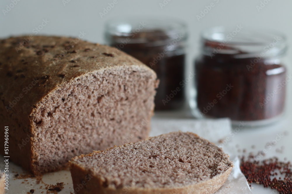Ragi bread or Finger millet bread. Loaf of home baked bread with finger millet flour sprinkled with fax seeds on top.