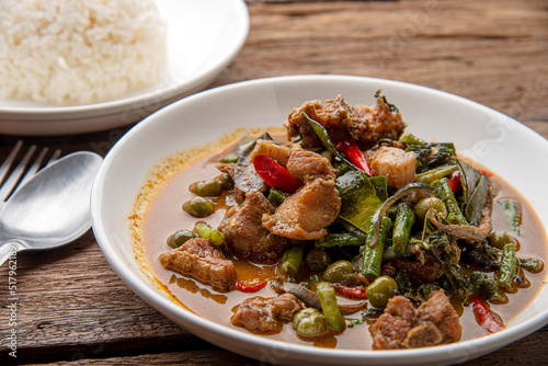 Stir fried pork belly and red curry paste with sting bean. Stir Fried Wild Boar with Red Curry