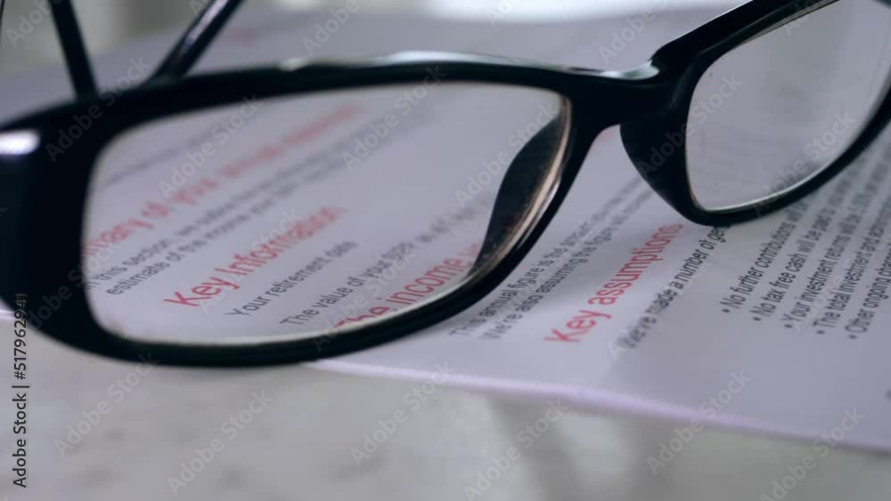 Pension statement through view of glasses Pension statement through view of glasses