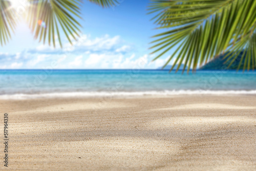 Fototapeta Naklejka Na Ścianę i Meble -  Beach sand with sun shadows and an open space on a lovely hot holiday day