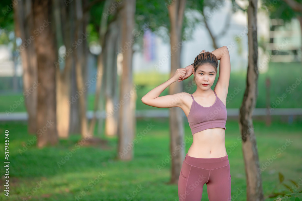 Asian beautiful slim woman at the park,Young girl love healthy exercise,Teen wear sportswear Asian beautiful slim woman at the park,Young girl love healthy exercise,Teen wear sportswear