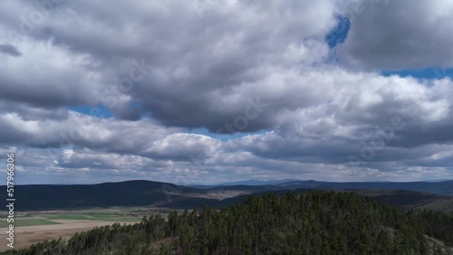 4k Timelapse of Majestic clouds shining through the colorful blue sky