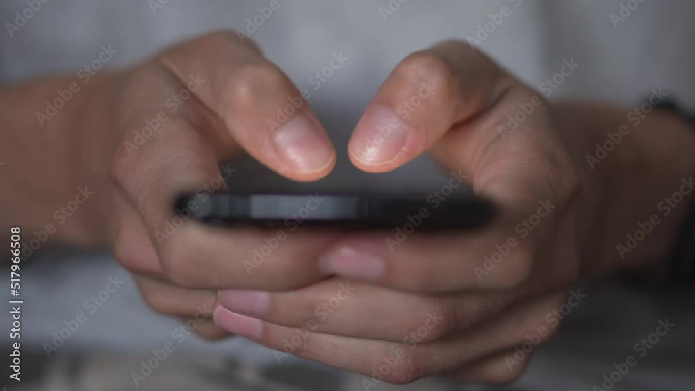 A young man uses a smartphone to write and send a message, close-up. Keep your cell phone in your hand. Mobile Tech 5g concept and people exchanging and reading sms on display. Browse and receive. A young man uses a smartphone to write and send a message, close-up. Keep your cell phone in your hand. Mobile Tech 5g concept and people exchanging and reading sms on display. Browse and receive.