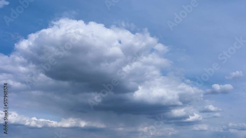 4k Timelapse of Majestic clouds shining through the colorful blue sky