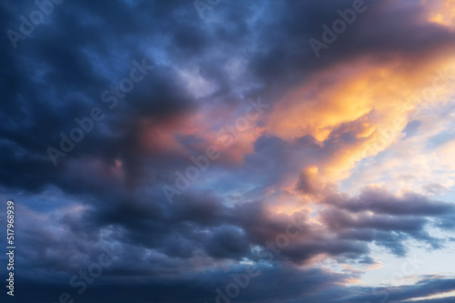 Background of a beautiful cloudy sky at sunset in twilight.