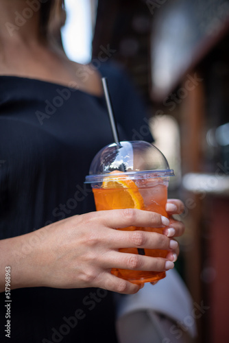 woman with cocktail in cafe