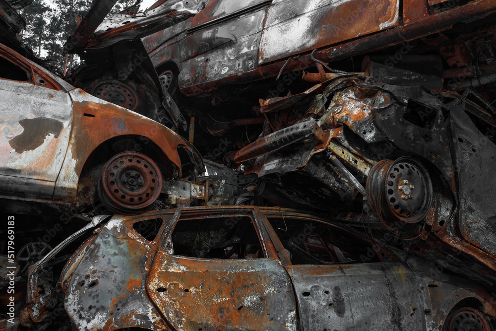 A dump of shot and burned cars as a result of the Russian invasion of Ukraine. War in Ukraine. A dump of shot and burned cars as a result of the Russian invasion of Ukraine. War in Ukraine.