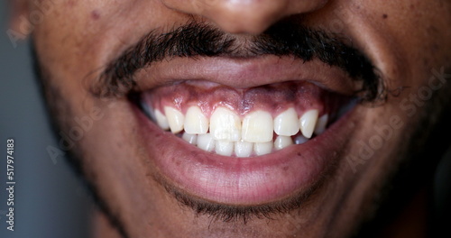 Lips macro close-up, black African man smiling