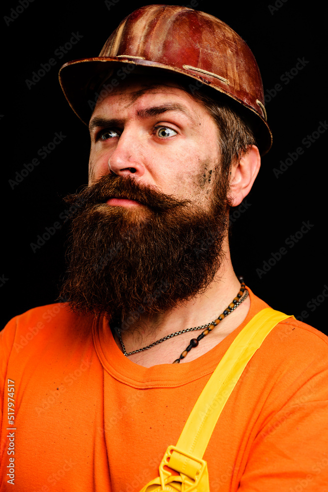Builder in hardhat. Industrial worker in overalls and helmet. Portrait of construction engineer. Builder in hardhat. Industrial worker in overalls and helmet. Portrait of construction engineer.