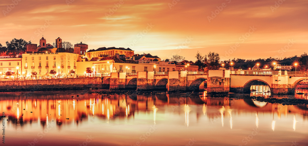 Panoramic view of the bridge and old town of Tavira in Algarve, Portugal.
