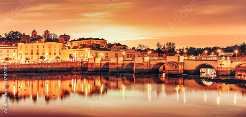 Panoramic view of the bridge and old town of Tavira in Algarve, Portugal.