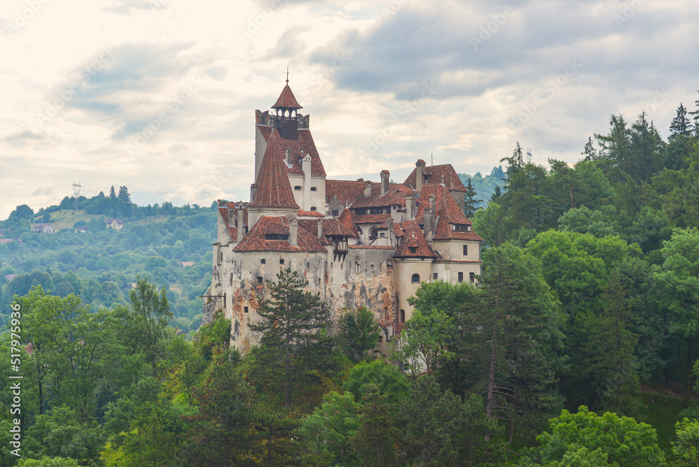  castle in the forest on zolm against a blue sky with clouds