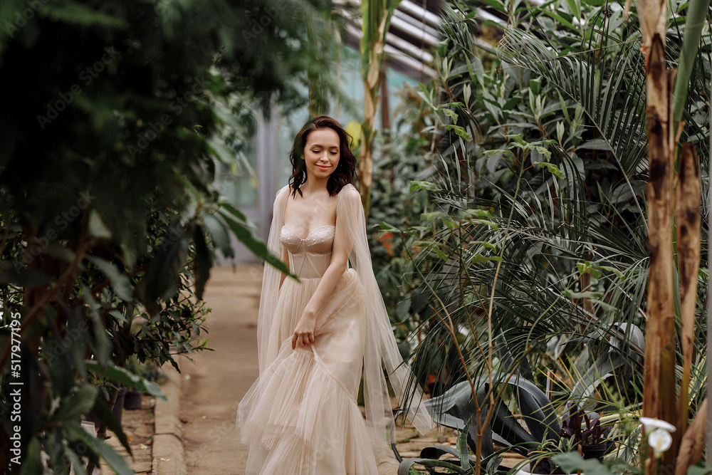 Beautiful young woman in a long white dress. Beautiful young woman in a long white dress.