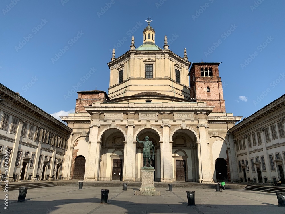 Front facade, exterior of Basilica San Lorenzo Maggiore. Main entrance to the church. Statue, monument in front. It is the oldest church in Milan and famous sightseeing place. Milan, Lombardy, Italy