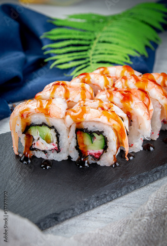 Sushi rolls with shrimp, cream cheese, unagi and tiger prawns. Traditional Japanese cuisine