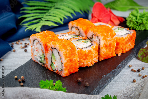 Sushi California rolls with crab, cream cheese, unagi and tiger shrimp. Traditional Japanese cuisine