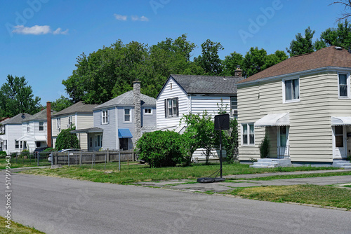 American suburban residential street with two story clapboard houses © Spiroview Inc.