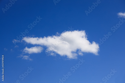 White cumulus cloud in a summer blue sky