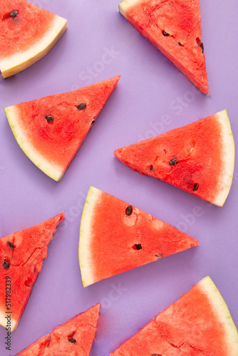 Watermelon slices pattern on violet background  . Summer concept