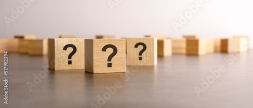 three question marks written on wood blocks