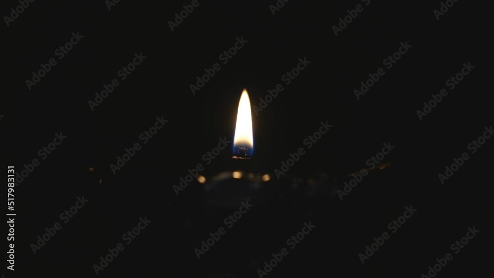 Candles burn in an Orthodox church. Burning candles that stand in a row. Church candles burn on a large gold candlestick in the church