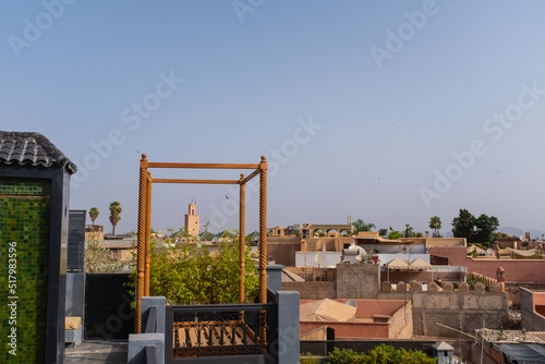 Marrakesh skyline with tower Mosque landmarks from a rooftop on a blue sky photo