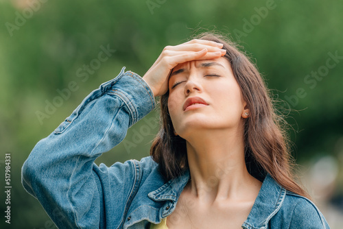 girl with her hand on her head with an expression of forgetfulness or pain