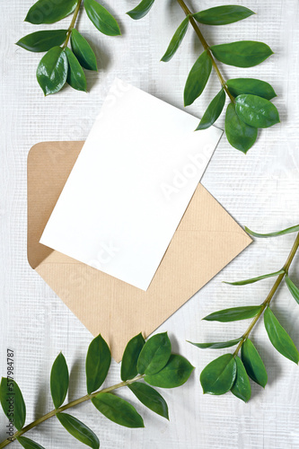 Mock up card with plants. Invitation card with envelope on white background.