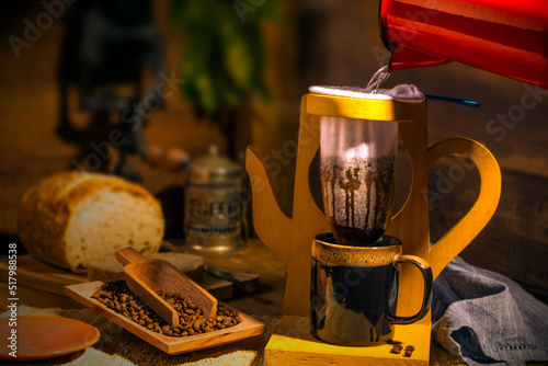 coffee filter cloth on a wooden support in the shape of a teapot. photo