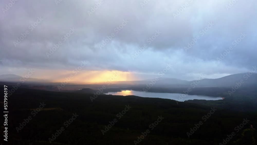 Aerial view of Loch Morlich at sunset in Cairngorms National Park, Scotland. Aerial view of Loch Morlich at sunset in Cairngorms National Park, Scotland.