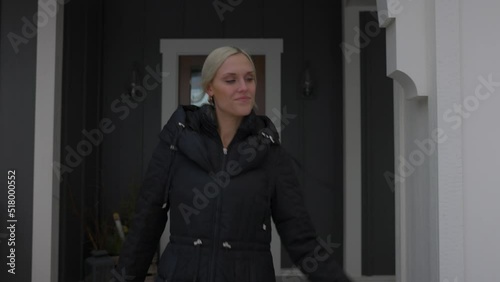 Wallpaper Mural Woman walking outside of the front door and walking down a path to her car. Torontodigital.ca