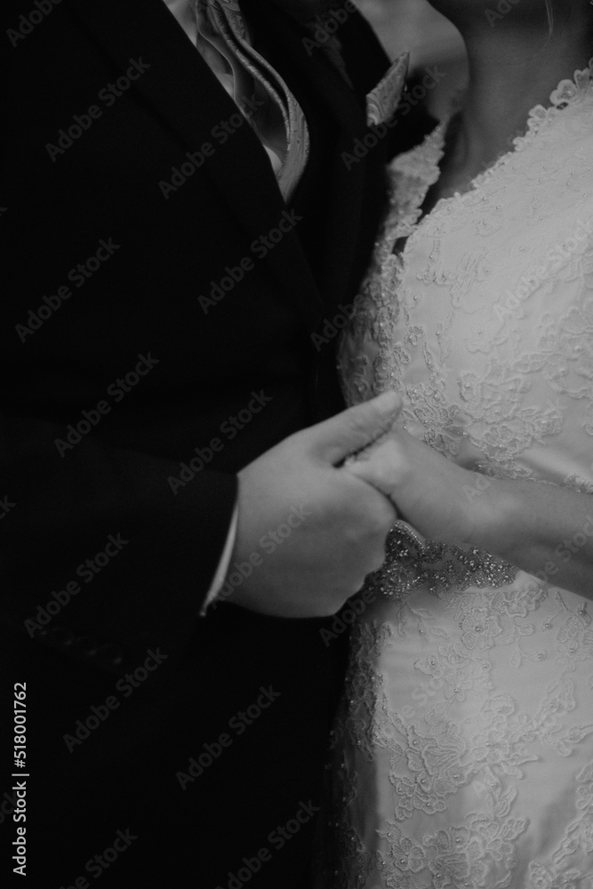 bride and groom holding hands