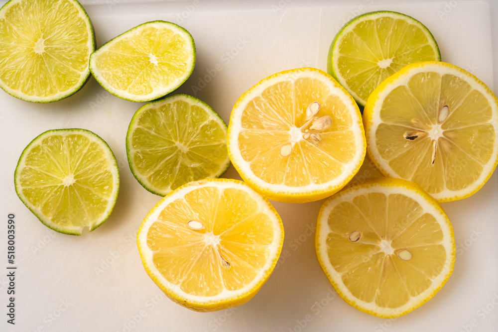 Lemon and lime slices on the board citrus fruit fresh healthy summer concept