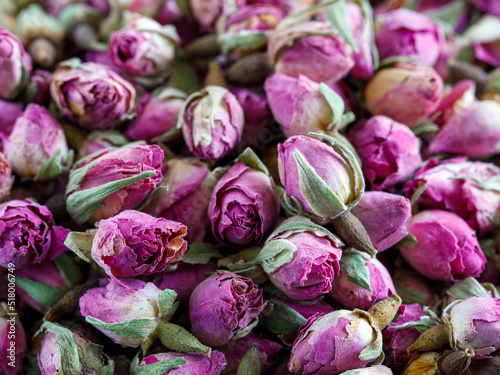 Heap of dried rosebuds background texture closeup. Pink violet rosebud macro close up © Lyudmila