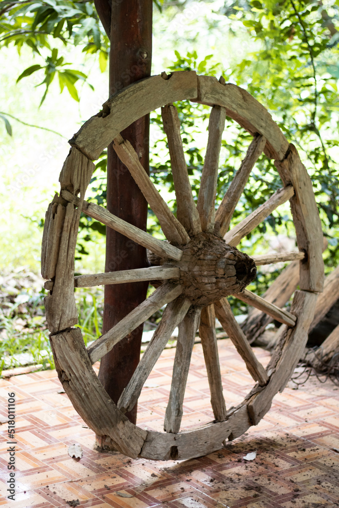 An old wagon wheel is placed in the pavilion.