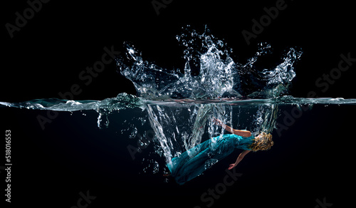 Girl in green dress under water