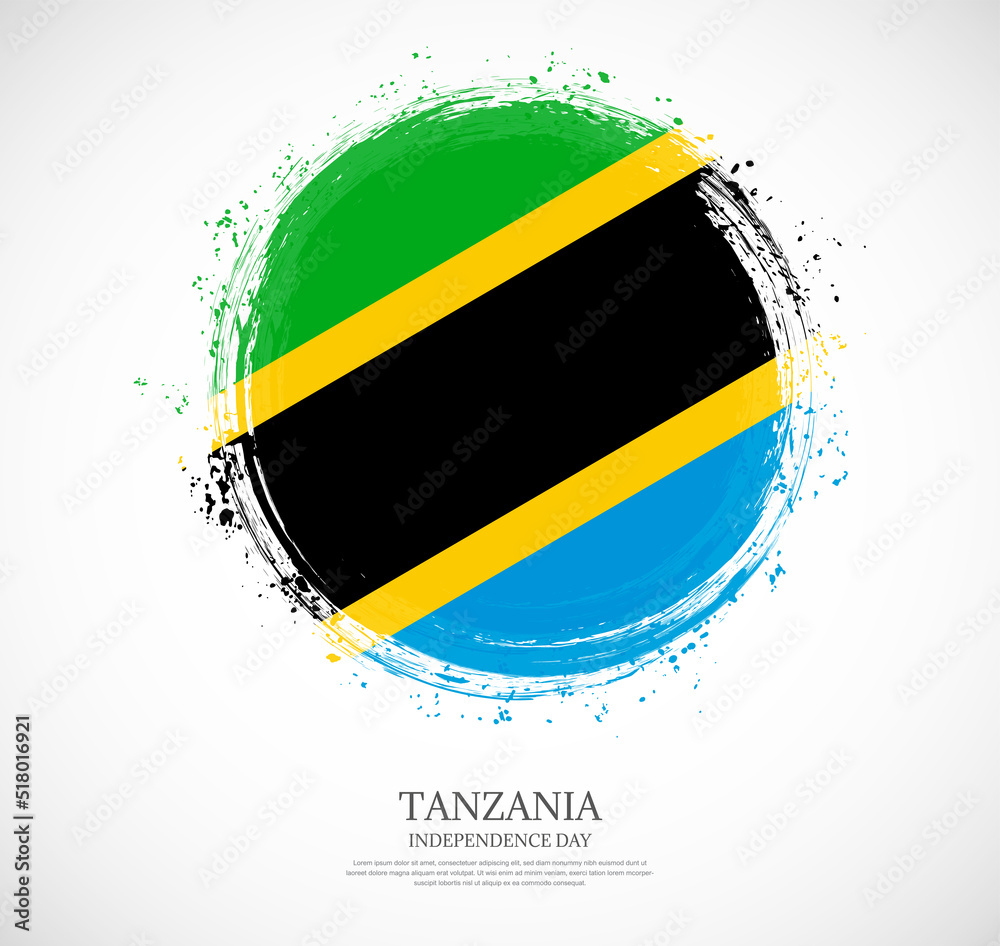 Obraz premium Creative circular grungy shape brush stroke flag of Tanzania on a solid background