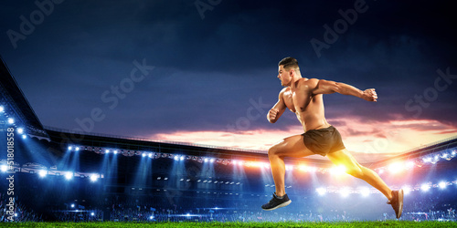 Male runner against stadium . Mixed media