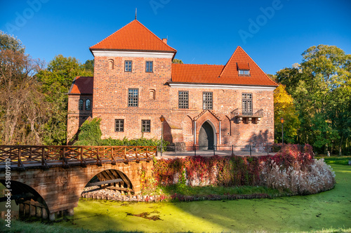 Oporowski Castle build in the Gothic style in the years 1434 - 1449. Oporow, Lodz Voivodeship, Poland. photo